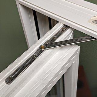 Low Quality Vinyl Window: Cheap hardware system made with folded metal sheets or metal stamped parts