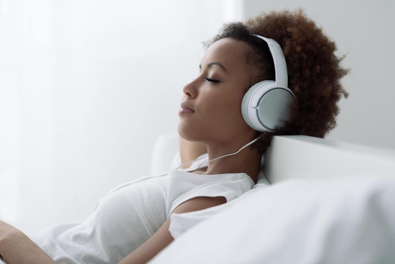 Woman Relaxing And Listening Music