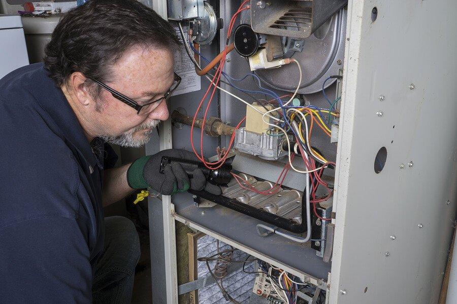 repairing HVAC unit